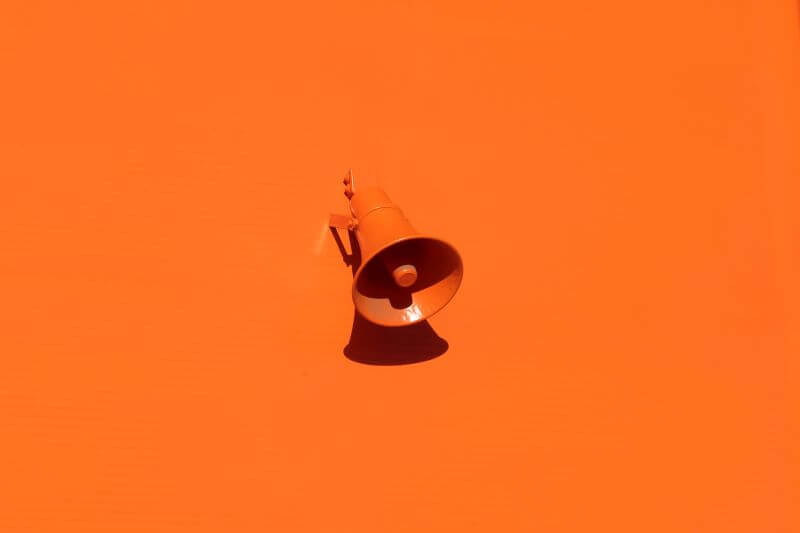 Megaphone on a bright orange background, representing the IPTVWow reseller program announcement